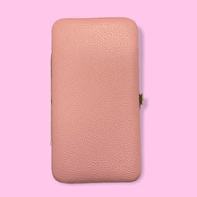 Load image into Gallery viewer, a piece of luggage sitting on a pink surface 
